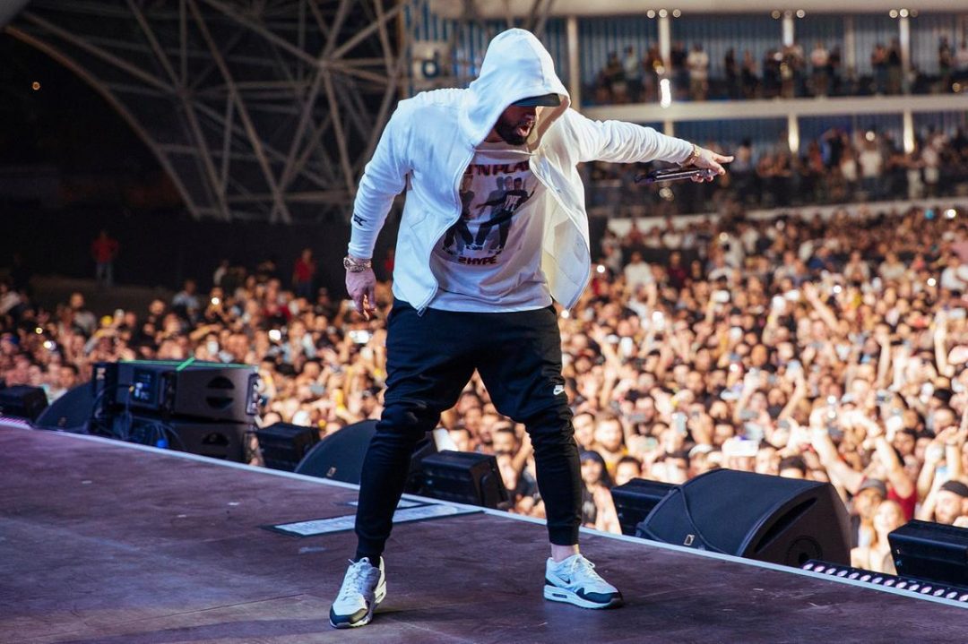 Eminem performing on stage during the world tour in 2025