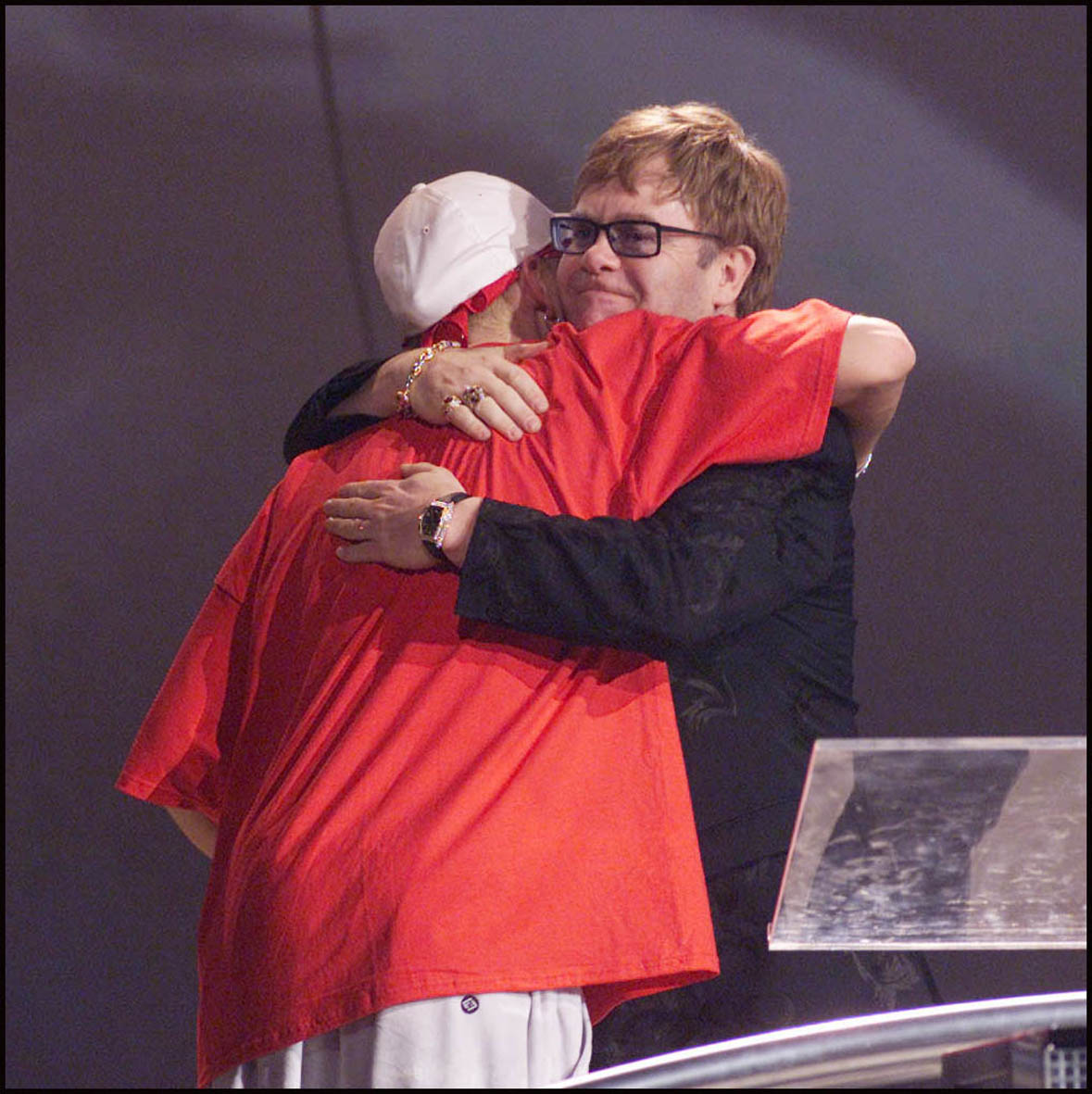 LONDON - FEBRUARY 26: American rap star Eminem accepts an award from British musician Sir Elton John on stage at the 2001 Brit Awards held at Earls Court Exhibition Centre on February 26, 2001 in London. (Photo by Dave Hogan/Getty Images)
