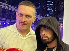 Watch Eminem Sign a Glove for Usyk Back in Saudi Arabia